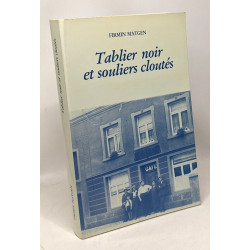 Tablier noir et souliers cloutés