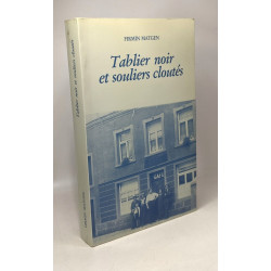 Tablier noir et souliers cloutés